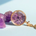 Amethyst crystal chips inside a round gold wishing bottle keychain with link chain - Amethyst