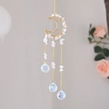 Golden moon suncatcher with wire-wrapped crystal stones and hanging rainbow prisms - White Crystal
