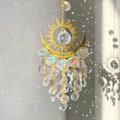 Macro shot of sun and moon crystal suncatcher reflecting rainbow light on white wall - 32cm / Clear