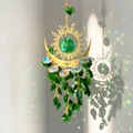 Detailed sun and moon suncatcher with green crystal prisms reflecting rainbows on a wall - 32cm / Green