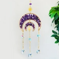 Detail of bohemian suncatcher with double moon frame, purple amethyst and crystal prism - Amethyst