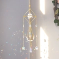 Golden geometric suncatcher with raw crystal and prism balls creating rainbow light - Howlite / 55cm