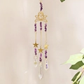 Detail view of golden lotus suncatcher with purple amethyst stones and faceted crystal prisms - Purple