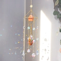Golden geometric suncatcher with raw red stone and crystal prisms casting rainbow light - Red Jasper / 55cm