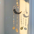 Bohemian moon suncatcher with golden crescent moon and black crushed stones hanging - Obsidian