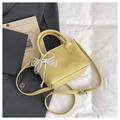Yellow litchi texture bucket bag with pearl bow pendant and adjustable strap detail - Yellow (With Pendant)