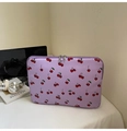 Detailed view of lavender laptop sleeve with cherry print and silver metal zippers - Purple