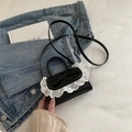 Black patent leather mini handbag with white lace trim and bow detail in crossbody style - Black