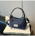 Detail of dark blue denim handbag with white graphic patch and plush bear accessory - With Pendant / Denim Black