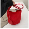 Elegant red faux suede bucket bag for women featuring a round charm and slim shoulder strap - Red