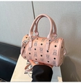 Detail showing pink boston bag with bear print, reinforced handles and shoulder strap - Basic Style / Pink