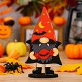 Halloween wooden gnome ornament featuring a vampire outfit with bat candy and red hat - Halloween Wooden Gnome Style D