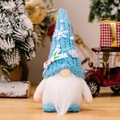 Gnomo di Natale in peluche blu lavorato a maglia con fiocchi di neve e sfondo festivo - Blu