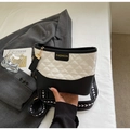Fashionable black and white contrast quilted handbag with wide patterned shoulder strap - Off White