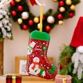 Christmas stocking shaped tin box with 'Let it Snow' design and hanging gold string - Snowman