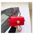 Elegant red leather handbag for women featuring a bold gold metal lock and top handle - Red
