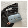 Light blue faux leather crossbody bag with gold heart buckle detail and adjustable strap - Blue