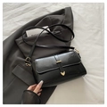 Elegant black glossy shoulder bag for women with gold heart accent and adjustable strap - Black