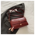 Elegant burgundy square shoulder bag with glossy finish and heart-shaped gold hardware - Red