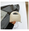 White quilted mini handbag with silver chain strap and top handle for elegant daily use - White