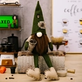 Green coffee gnome plush with long legs, holding coffee beans, sitting near coffee props - Green Pointed Hat Coffee Gnome Male