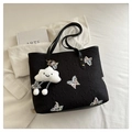 Close-up of black tote bag with butterfly embroidery and plush cloud charm accessory - With Pendant / Black