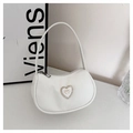 Detail of white crescent shoulder bag featuring a sparkling rhinestone heart decoration - White