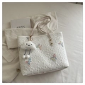 Detail of white quilted tote bag with butterfly embroidery and plush cloud pendant charm - With Pendant / White