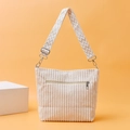 Close-up of beige corduroy tote bag with textured stripes and jacquard wide strap - Off White
