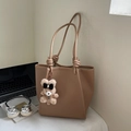 Brown faux leather tote bag with unique knot handles and a cute plush bear charm - Khaki