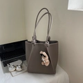 Minimalist dark coffee leather tote bag with knotted handles and a cute bear charm - Gray