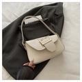 Elegant cream-colored underarm bag with a large gold buckle and matching shoulder strap - White
