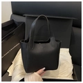 Close-up of black litchi grain leather bucket bag with embossed Fashion & Bags logo - No Pendant / Black