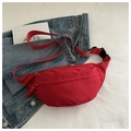 Minimalist red nylon waist bag for women with woven zipper detail and adjustable strap - Red