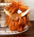 Dettaglio del peluche mucca delle Highland a pelo lungo con decorazione a fiori bianchi - Marrone Rosso