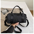 Minimalist black nylon barrel bag with woven handles and adjustable shoulder strap - Large / Black