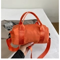 Orange cylindrical nylon handbag with matching woven straps and adjustable shoulder belt - Large / Orange