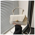 Detail of minimalist white crossbody bag with knotted handle and gold metal clasp - White