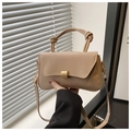 Detail view of the beige PU leather handbag showing knot handle and gold metal buckle - Khaki