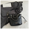Fashionable black bucket bag with gold chain handle and adjustable strap on a blazer - No Pendant / Black / Small