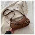Brown crescent underarm bag in faux leather featuring a bold silver buckle and strap - Brown