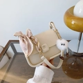 Cream square shoulder bag with silk scarf handle and white plush charm accessory - With Pendant / Off-white