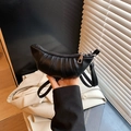 Fashionable black croissant crossbody bag with pleated synthetic leather and silver zipper - Black