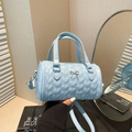 Light blue quilted Boston bag with silver bow detail and detachable strap - Blue