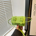 Bright green crossbody bag with decorative belt straps and a minimalist flap design - Green