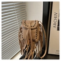 Detail of khaki leather mini bag featuring metallic rivets and long tassel decorations - Khaki