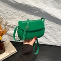 Emerald green leather saddle bag for women with adjustable strap and metal buckle - Green