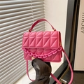 Bright pink crossbody bag with geometric quilted pattern and acrylic chain strap - Pink