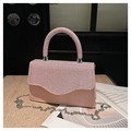 Detailed view of pink evening handbag featuring sparkling rhinestones and silver chain strap - Pink