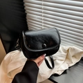 Minimalist black glossy faux leather saddle bag with round ball button detail - Black